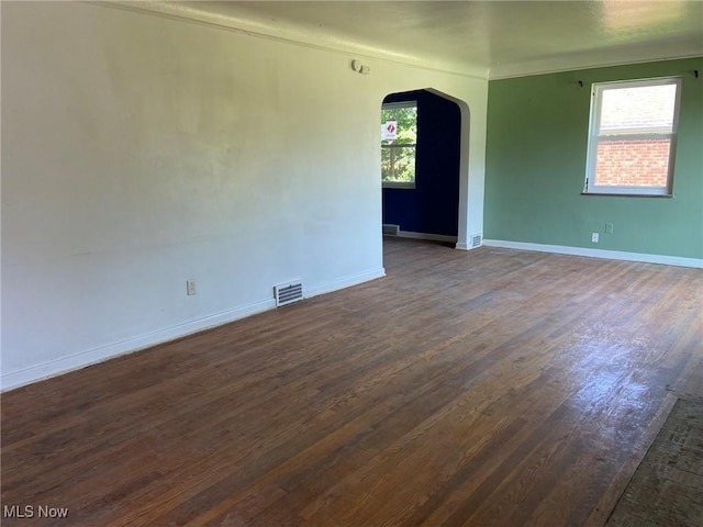 20171 Lake Shore Blvd, Euclid, OH 44123 - unfurnished room with arched walkways and dark wood-style floors