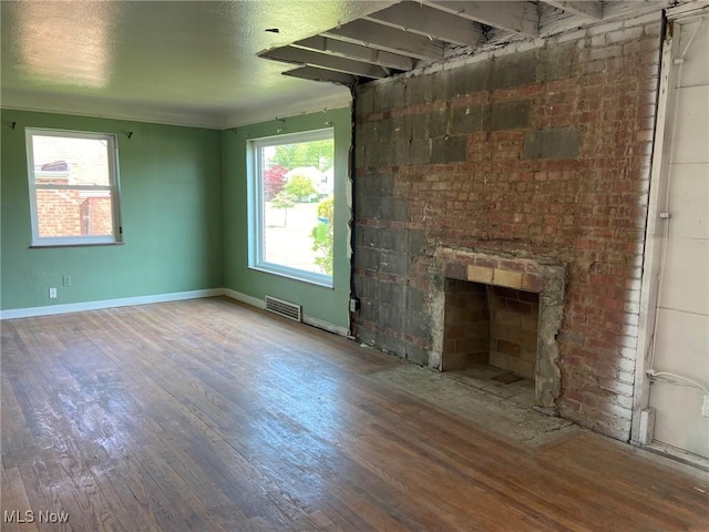 20171 Lake Shore Blvd, Euclid, OH 44123 - unfurnished living room with wood finished floors and a fireplace