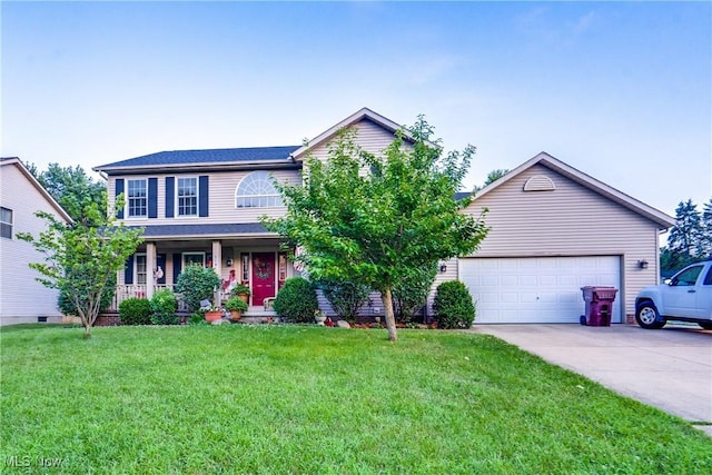 11912 Packets St NW, Canal Fulton, OH 44614 - view of front facade featuring covered porch, driveway, a front lawn, and a garage
