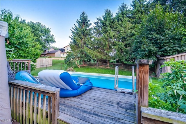 11912 Packets St NW, Canal Fulton, OH 44614 - view of swimming pool with a deck and a fenced backyard