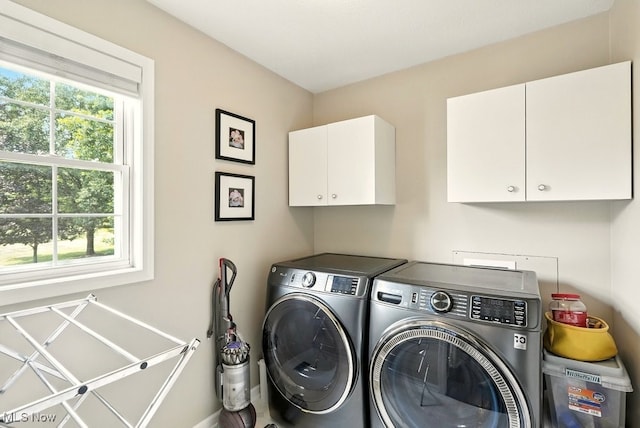 4020 Bishops Gate Cir, Stow, OH 44224 - laundry room featuring cabinet space and washer and dryer
