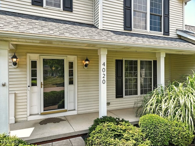 4020 Bishops Gate Cir, Stow, OH 44224 - view of exterior entry featuring a porch and roof with shingles