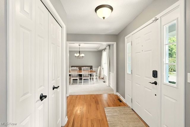 4020 Bishops Gate Cir, Stow, OH 44224 - entrance foyer featuring light wood-style flooring and a chandelier