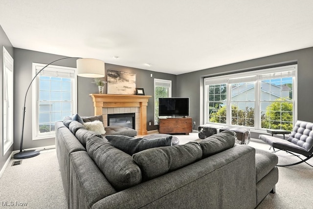 4020 Bishops Gate Cir, Stow, OH 44224 - carpeted living room featuring a tiled fireplace and baseboards