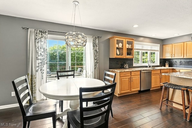 4020 Bishops Gate Cir, Stow, OH 44224 - kitchen with dishwasher, decorative backsplash, dark wood-style floors, glass insert cabinets, and light stone counters