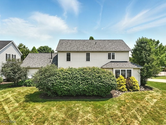 4020 Bishops Gate Cir, Stow, OH 44224 - rear view of property with a yard and a shingled roof