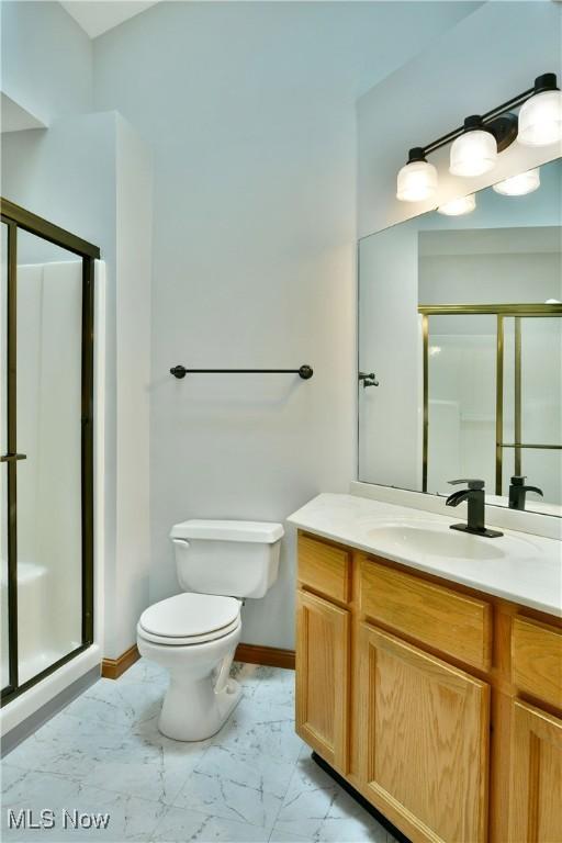106 N Aspen Ct Unit 4, Warren, OH 44484 - full bathroom featuring marble finish flooring, a stall shower, and vanity