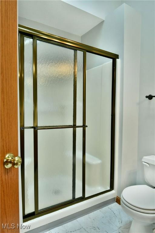 106 N Aspen Ct Unit 4, Warren, OH 44484 - bathroom with a stall shower and marble finish floors