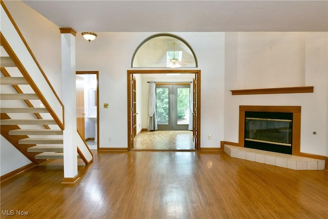 106 N Aspen Ct Unit 4, Warren, OH 44484 - entrance foyer featuring wood finished floors, stairway, and a glass covered fireplace