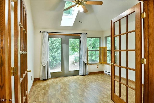 106 N Aspen Ct Unit 4, Warren, OH 44484 - doorway with lofted ceiling, a skylight, a baseboard heating unit, french doors, and ceiling fan