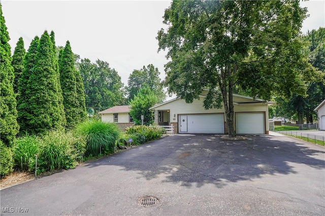 570 Rawlins Ave, New Franklin, OH 44319 - view of front of house with driveway and a garage