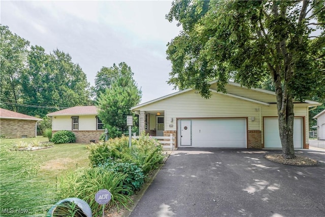 570 Rawlins Ave, New Franklin, OH 44319 - single story home featuring driveway, a garage, a front yard, and brick siding