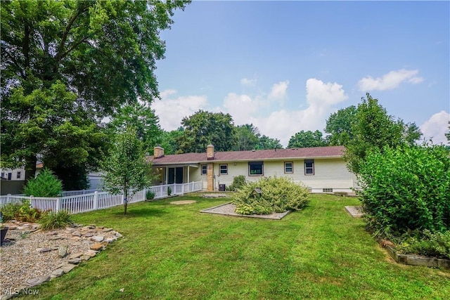 570 Rawlins Ave, New Franklin, OH 44319 - back of property featuring a garden and a chimney