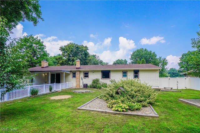 570 Rawlins Ave, New Franklin, OH 44319 - rear view of house featuring a vegetable garden and a chimney