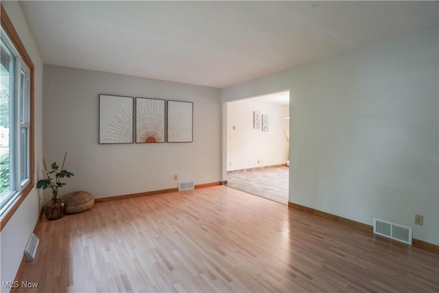 570 Rawlins Ave, New Franklin, OH 44319 - empty room featuring plenty of natural light and wood finished floors