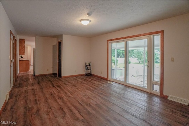 570 Rawlins Ave, New Franklin, OH 44319 - unfurnished room with wood finished floors and a textured ceiling