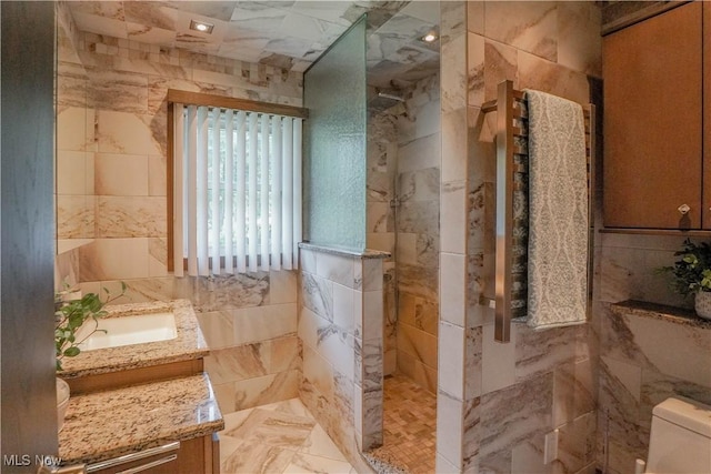 570 Rawlins Ave, New Franklin, OH 44319 - bathroom with tile walls, vanity, and walk in shower