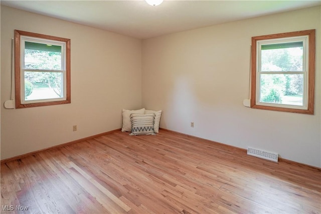 570 Rawlins Ave, New Franklin, OH 44319 - spare room featuring healthy amount of natural light and light wood-style floors