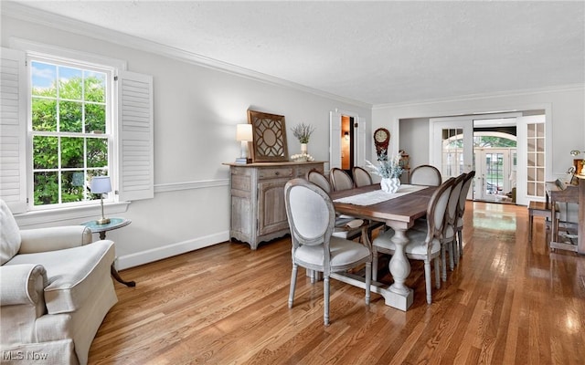 335 N Union Ave, Salem, OH 44460 - dining space with wood finished floors, healthy amount of natural light, crown molding, and french doors
