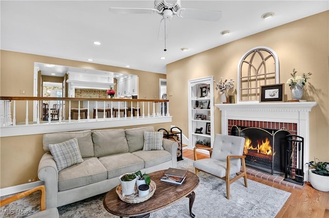 335 N Union Ave, Salem, OH 44460 - living room with wood finished floors, a brick fireplace, a ceiling fan, and recessed lighting