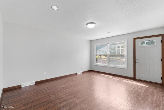 1241 Sparhawk Ave, Akron, OH 44305 - foyer entrance with wood finished floors, healthy amount of natural light, and a textured ceiling