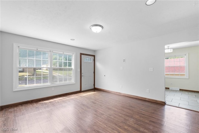 1241 Sparhawk Ave, Akron, OH 44305 - empty room with wood finished floors and plenty of natural light
