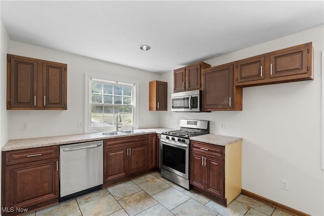 1241 Sparhawk Ave, Akron, OH 44305 - kitchen with appliances with stainless steel finishes, light countertops, and light tile patterned flooring