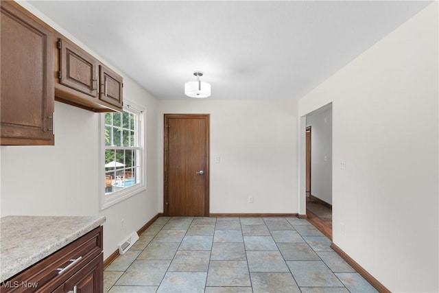 1241 Sparhawk Ave, Akron, OH 44305 - kitchen with light countertops and baseboards