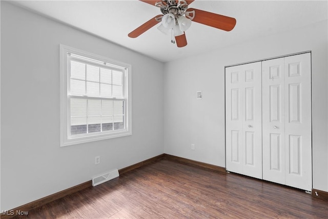 1241 Sparhawk Ave, Akron, OH 44305 - unfurnished bedroom with dark wood finished floors, a closet, and ceiling fan