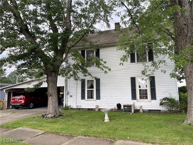 444 5th St NW, New Philadelphia, OH 44663 - view of front facade with concrete driveway, a front lawn, and a chimney
