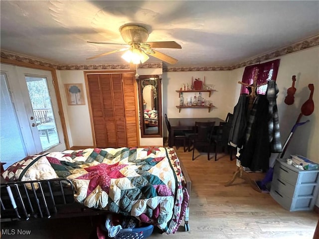 444 5th St NW, New Philadelphia, OH 44663 - bedroom with light wood-type flooring, a ceiling fan, and a closet