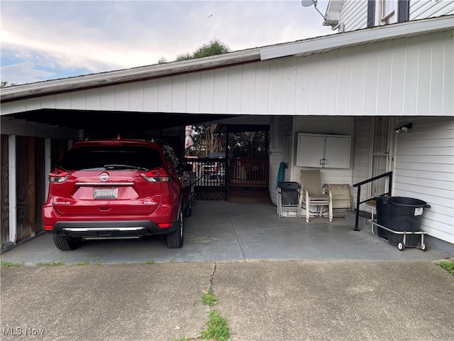 444 5th St NW, New Philadelphia, OH 44663 - garage featuring a carport and driveway