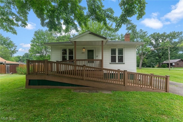 2045 Overland Ave NE, Warren, OH 44483 - back of house featuring a chimney, a wooden deck, and a yard
