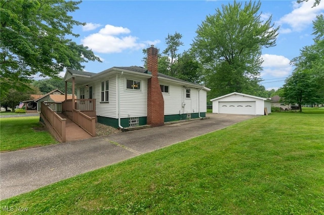 2045 Overland Ave NE, Warren, OH 44483 - view of side of property featuring an outdoor structure, a chimney, a garage, and a yard
