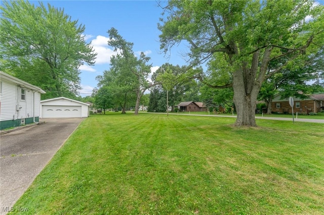 2045 Overland Ave NE, Warren, OH 44483 - view of grassy yard featuring an outdoor structure and a detached garage