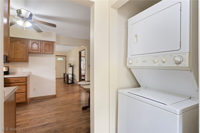 2045 Overland Ave NE, Warren, OH 44483 - washroom featuring stacked washer / dryer, wood finished floors, and ceiling fan