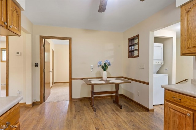 2045 Overland Ave NE, Warren, OH 44483 - corridor featuring stacked washing machine and dryer and light wood-style floors