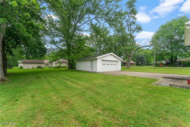 2045 Overland Ave NE, Warren, OH 44483 - view of green lawn featuring an outbuilding and a garage