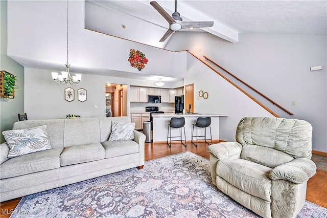 3310 Trappers Trl Unit C, Cortland, OH 44410 - living room with a ceiling fan, wood finished floors, and a chandelier