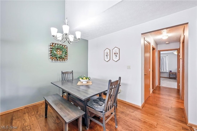 3310 Trappers Trl Unit C, Cortland, OH 44410 - dining room with a chandelier and light wood-type flooring