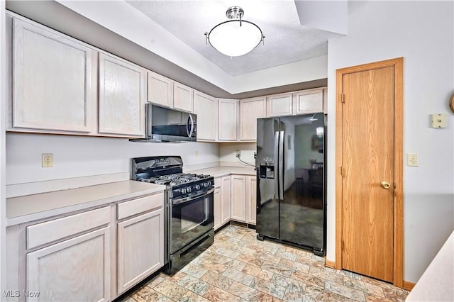 3310 Trappers Trl Unit C, Cortland, OH 44410 - kitchen with black appliances, light countertops, and light stone finish floors