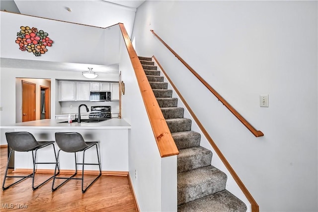 3310 Trappers Trl Unit C, Cortland, OH 44410 - stairway featuring wood finished floors and baseboards