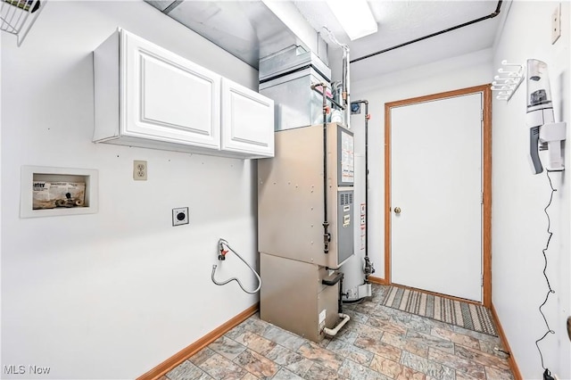 3310 Trappers Trl Unit C, Cortland, OH 44410 - laundry area with cabinet space, hookup for an electric dryer, stone finish flooring, and washer hookup