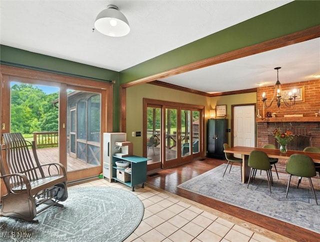 19070 Ridgeview Trl, Chagrin Falls, OH 44023 - tiled living room featuring a chandelier, healthy amount of natural light, and ornamental molding