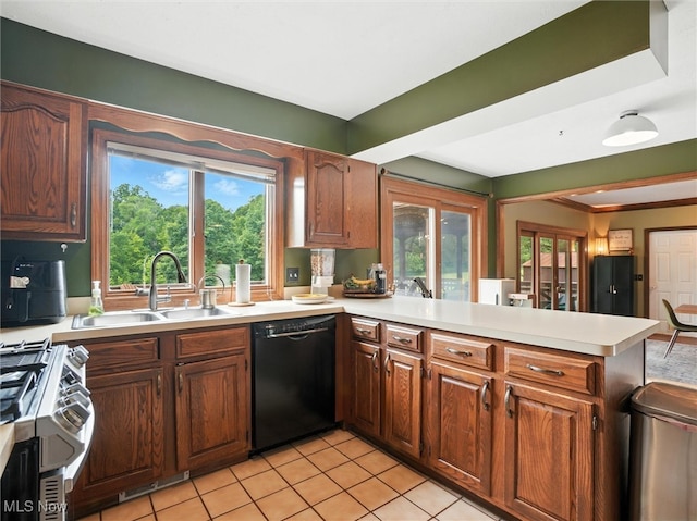 19070 Ridgeview Trl, Chagrin Falls, OH 44023 - kitchen with black dishwasher, stainless steel stove, a peninsula, light countertops, and light tile patterned floors