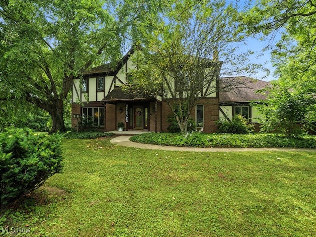 19070 Ridgeview Trl, Chagrin Falls, OH 44023 - english style home with a front lawn, stucco siding, and brick siding