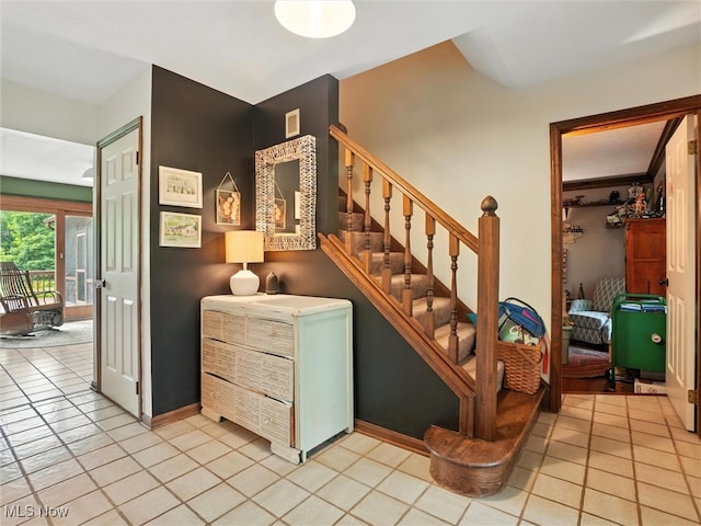 19070 Ridgeview Trl, Chagrin Falls, OH 44023 - stairs with tile patterned floors and baseboards