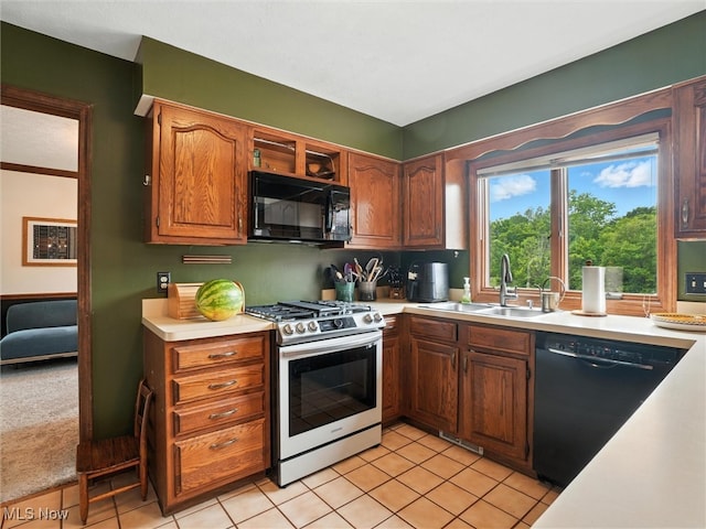 19070 Ridgeview Trl, Chagrin Falls, OH 44023 - kitchen with black appliances, light countertops, and light tile patterned flooring