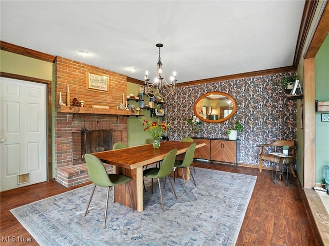 19070 Ridgeview Trl, Chagrin Falls, OH 44023 - dining space featuring ornamental molding, wallpapered walls, a chandelier, wood finished floors, and a fireplace
