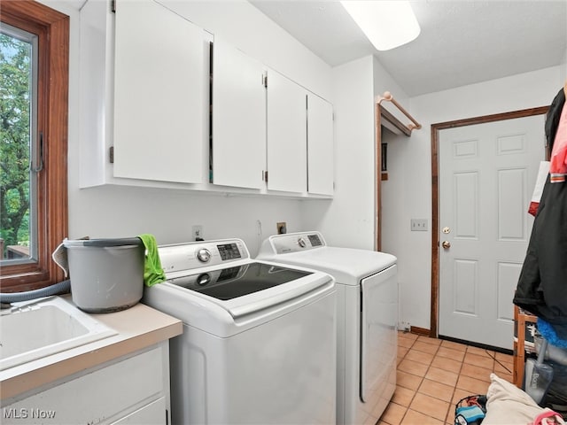 19070 Ridgeview Trl, Chagrin Falls, OH 44023 - washroom with cabinet space, washer and dryer, and light tile patterned floors